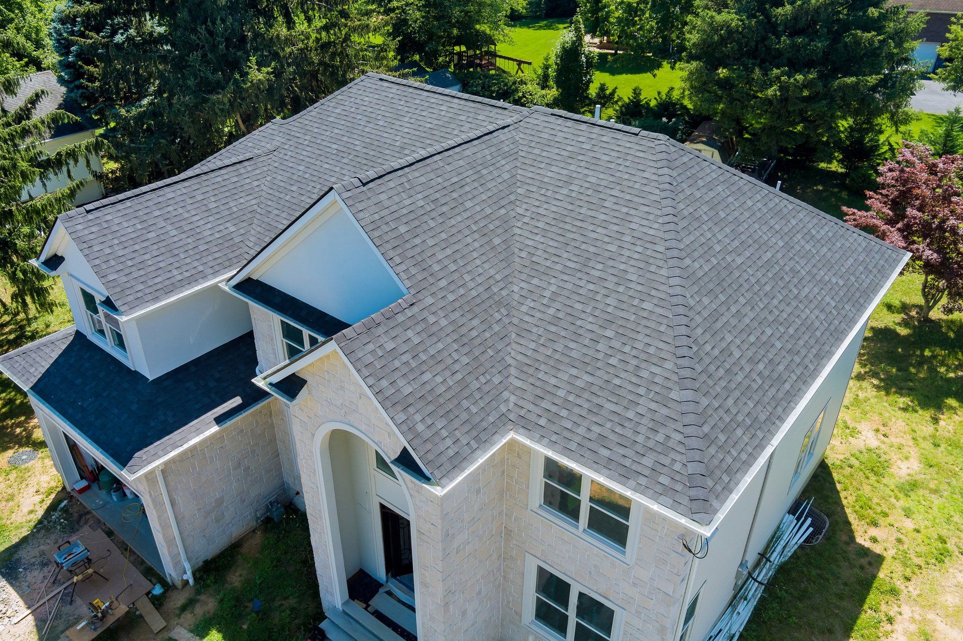 Residential house with new asphalt shingle roof
